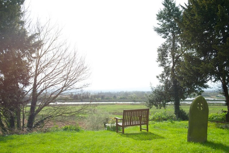 The churchyard looks out over Oare Creek