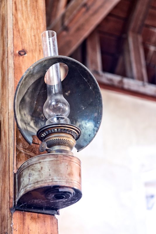 One of a pair of Victorian oil lamps either side of the Victorian organ in Throwley Church