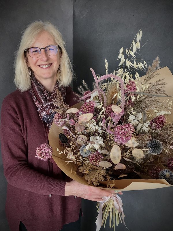 Stephanie holding a stylish bunch of Country Lane's dried flowers