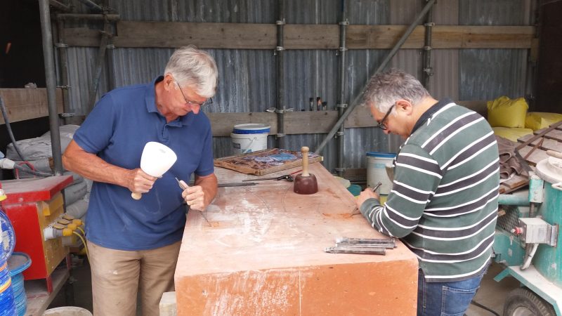 John Meardon and Vartan Moskofian start work on the Khachkar