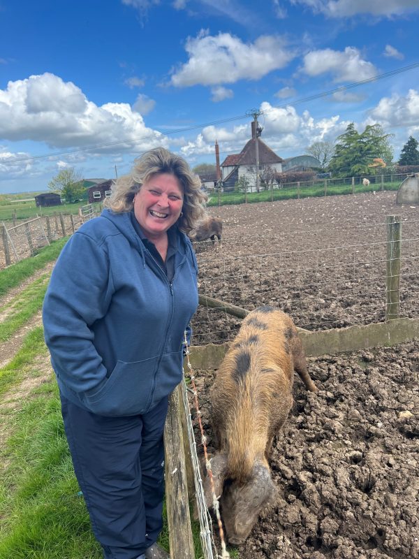 Julie Murray and one of her many pigs