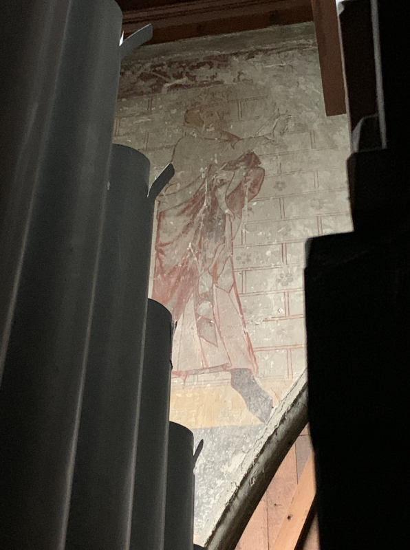 The painting of St Edward the Confessor in St Mary of Charity in Faversham, seen from within the organ