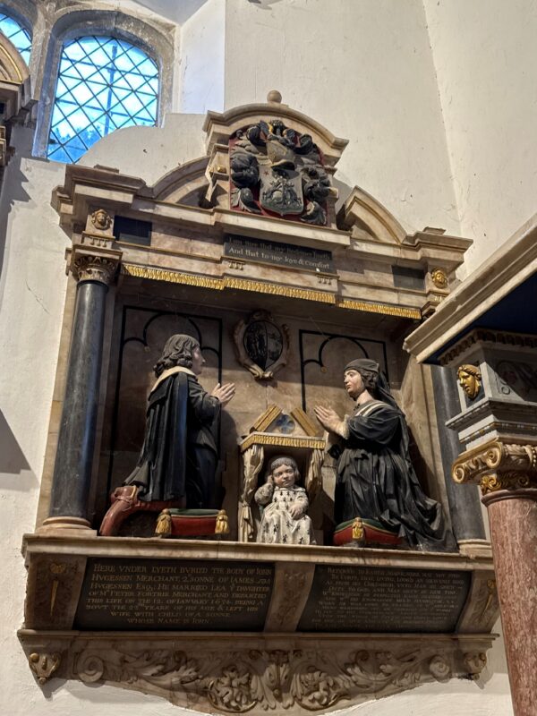 Monument to John Hugessen 1634. His son peeping out from under the prayer desk
